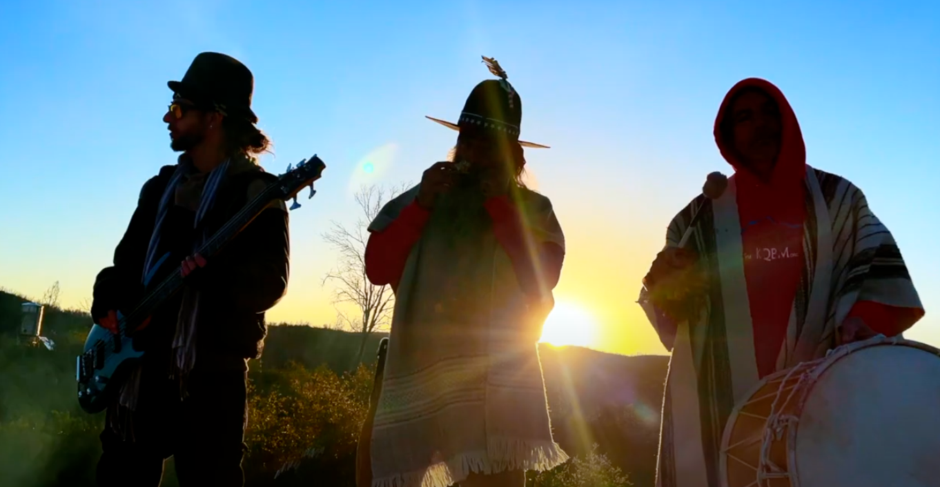 Clip from Goodmorning Grandmother video showing silhouetted members of Clan Dyken playing at sunrise.